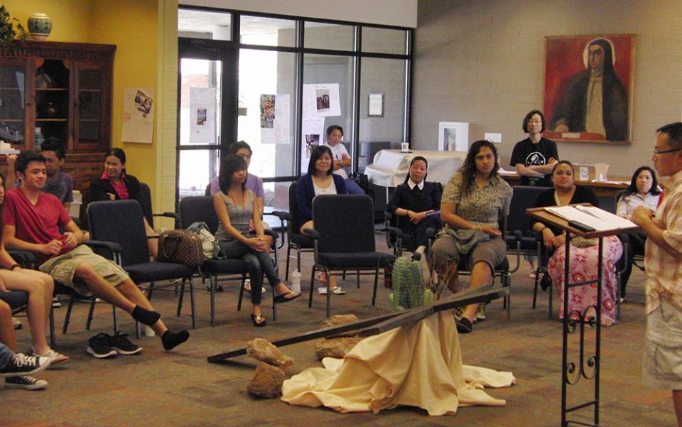 Lovers of the Holy Cross Sr. Jennifer Nguyen (in religious habit), the director of the Office of Asian and Pacific Ministry of the Diocese of San Bernardino, California, joins young adults in a leadership workshop in Tucson, Arizona. (Peter Tran)
