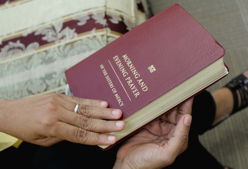 A Mercy sister uses the institute’s "Morning and Evening Prayer of the Sisters of Mercy." (Provided photo) A Mercy sister uses the institute’s "Morning and Evening Prayer of the Sisters of Mercy." (Provided photo)