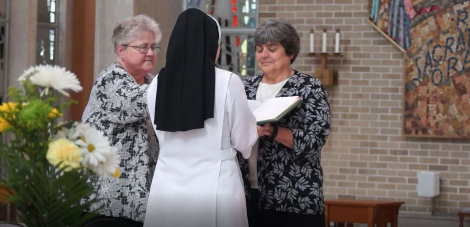 Springfield Dominican Sr. Rebecca Ann Gemma, right, receives the vow renewal of Sr. Kelly Moline in August 2019.
