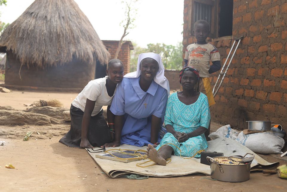 Sr. Lucy Akera visits a refugee family at Palabek camp Feb. 20 in northern Uganda. (GSR photo/Doreen Ajiambo) 