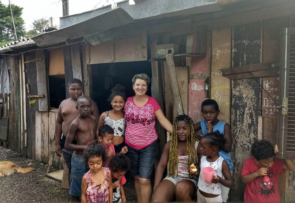 Sr. Rita Schneider with people in a community in Haiti where she ministered as a missionary (Courtesy of Rita Schneider)