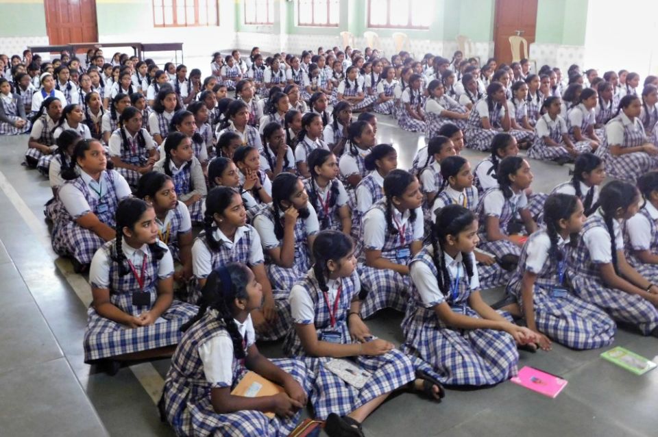 A group of students listen to Franciscan Hospitaller Sr. Rosita Gomes on devotion to Mary in October at Mary Immaculate School, Panaji, capital of the western India state of Goa. (Provided photo) A group of students listen to Franciscan Hospitaller Sr. Rosita Gomes on devotion to Mary in October at Mary Immaculate School, Panaji, capital of the western India state of Goa. (Provided photo)