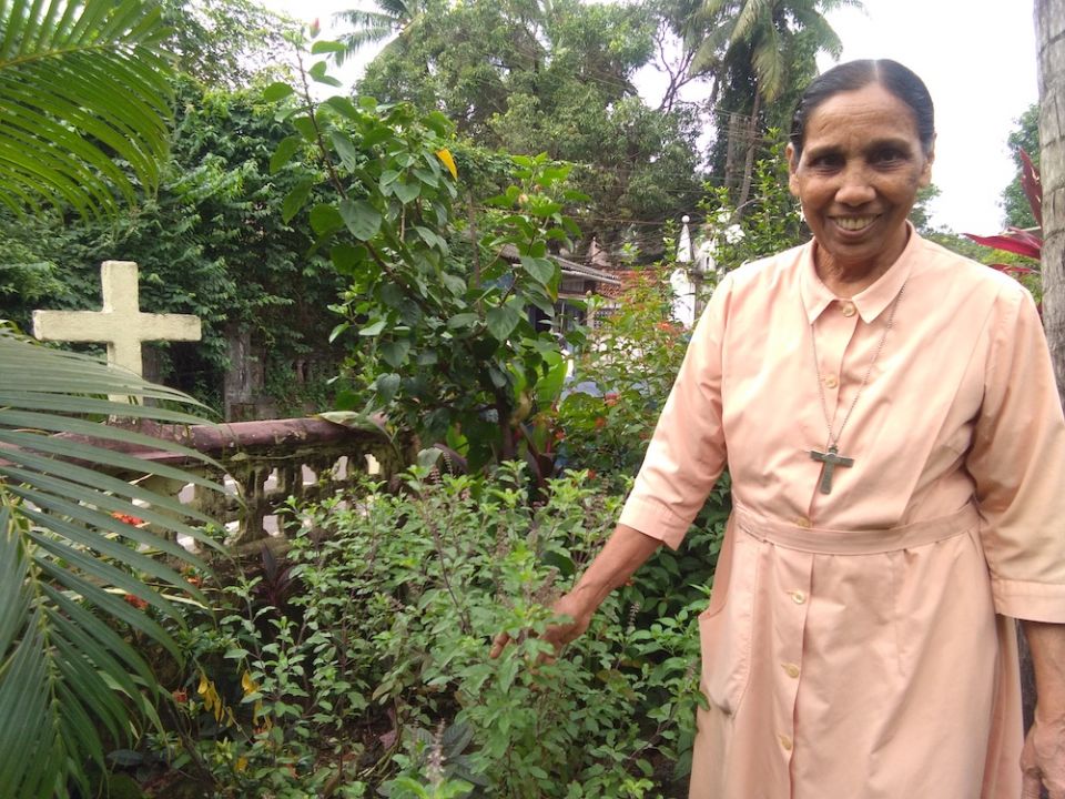 Sr. Scholastica Panthaladikel of the Pious Disciples of the Divine Master stands in an herb garden at their holistic healing center in Mapusa, Goa, in western India. (Lissy Maruthanakuzhy)