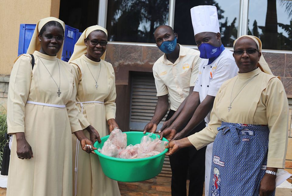 From left, Srs. Rose Thumitho, Florence Anaso and Mary Atema of the Little Sisters of St. Francis of Assisi deliver chicken meat to their clients on Feb. 23 in Jinja, Uganda. (Doreen Ajiambo)