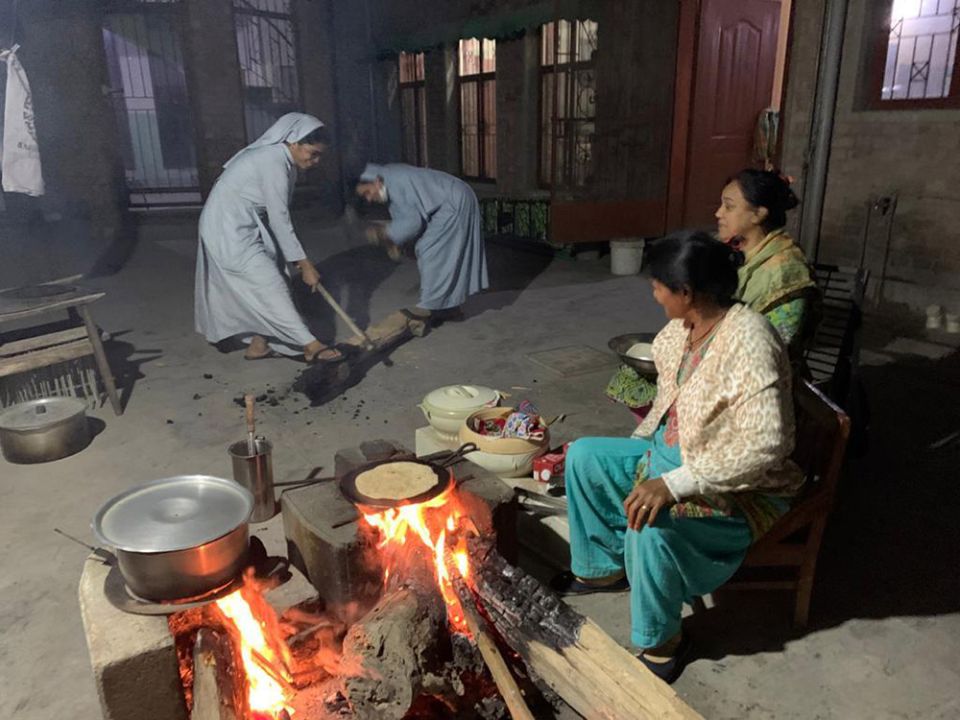 Sisters of Charity of Jesus and Mary cut wood for cooking amid gas cuts in Pakistan this past winter. (Courtesy of Sabina Barkat)