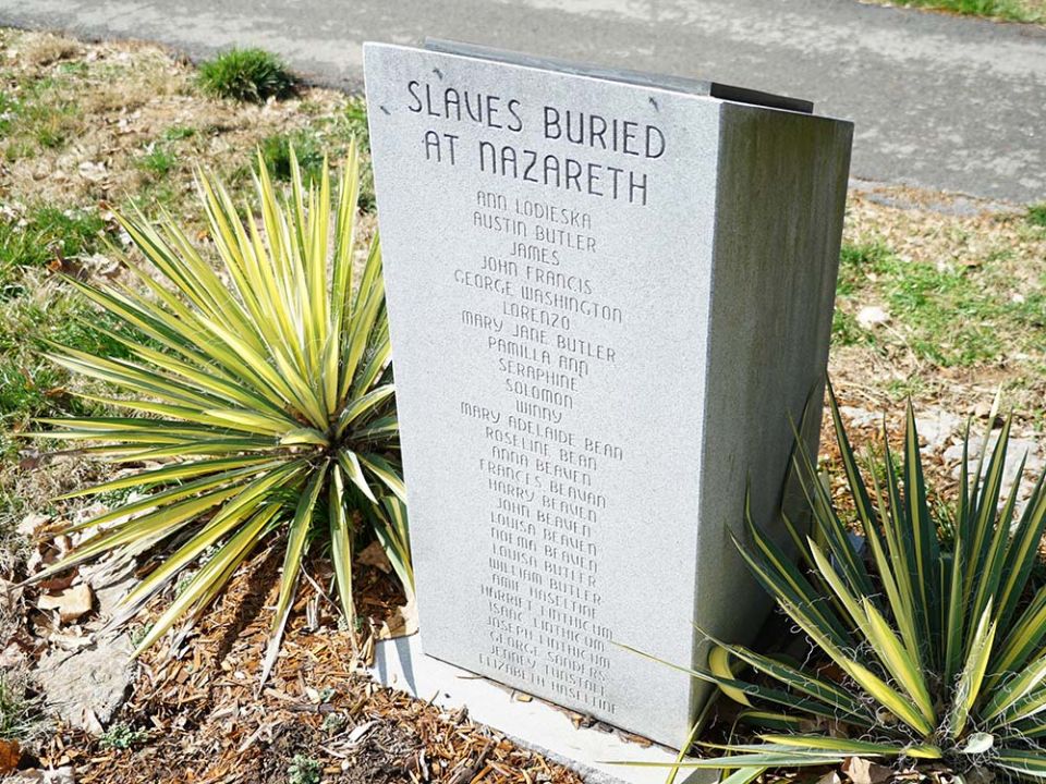 A headstone placed in the Sisters of Charity of Nazareth, Kentucky, cemetery in 2012 for the 28 enslaved people buried there (Courtesy of the Sisters of Charity of Nazareth)