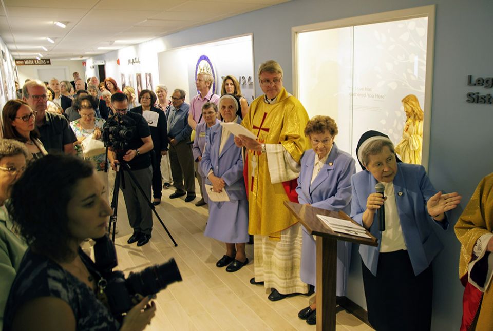 Sr. Regina Dubickas speaks at an Aug. 25, 2018, blessing of the legacy room of the Sisters of St. Casimir of Chicago's museum. To her right is Sr. Margaret Petcavage, vice postulator for the sainthood cause of Mother Maria Kaupas.