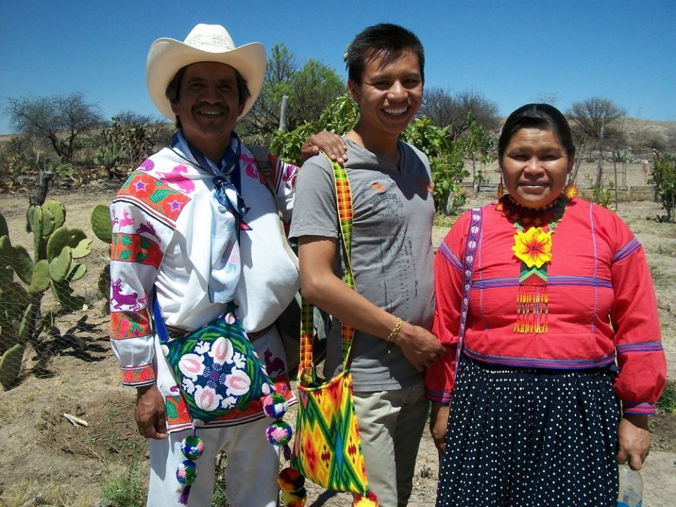 Joel, a Weavers of Hope grant student, with his parents, who are from the indigenous Huichol community in Jalisco, Mexico. His father, Armando, makes bead handicrafts. (Courtesy of Sr. Frances Smith) Joel, a Weavers of Hope grant student, with his parents, who are from the indigenous Huichol community in Jalisco, Mexico. His father, Armando, makes bead handicrafts. (Courtesy of Sr. Frances Smith)
