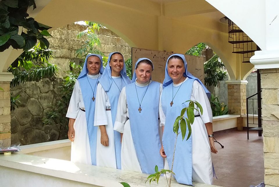 From left: Sr. Laetitia Gorczyca, Sr. Rachel Myriam Luxford, Sr. Sophie de Jésus and Sr. Edith Fabian, the four Missionaries of Mary sisters who are the heart of ACAY's School of Life and Second Chance programs, in front of their house in Balanga, the Phi