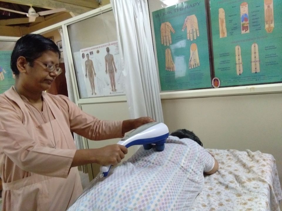 Sr. Flavia Aranha of the Pious Disciples of the Divine Master gives a massage to a patient as a part of holistic treatment at their center in Mapusa, Goa, in western India. (Lissy Maruthanakuzhy)