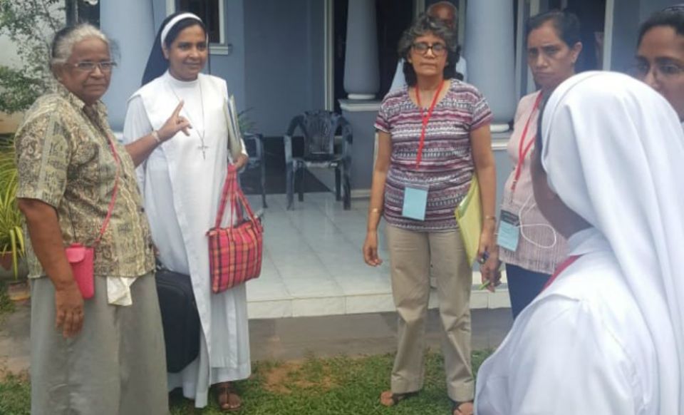 The church healing mission team does a quick evaluation before moving to another family affected by the bombings on Easter Sunday in Negombo, Sri Lanka. (Thomas Scaria)