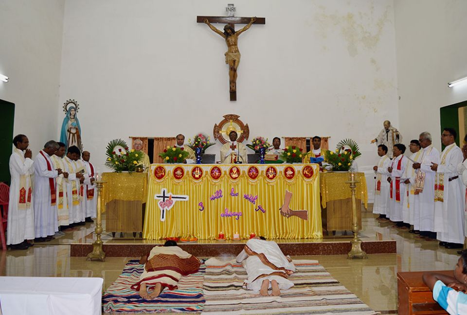 Sacred Heart Srs. Sujata Jena and Goretti Nayak prostrate before God as a complete surrender to his will during their final vows Oct. 11, 2014, at St. Vincent Catholic Church in Bhubaneswar, Odisha, India. (Courtesy of Sujata Jena)