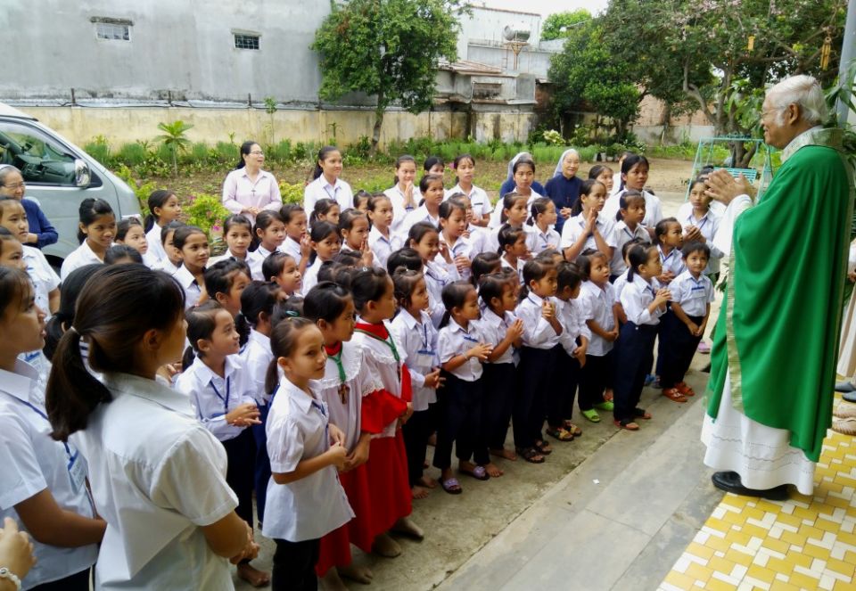 Jesuit Fr. Thomas Vu Quang Trung visits ethnic students at a hostel run by Sisters of Providence of Tay Nguyen in Kontum City, Vietnam. (Joachim Pham) Jesuit Fr. Thomas Vu Quang Trung visits ethnic students at a hostel run by Sisters of Providence of Tay Nguyen in Kontum City, Vietnam. (Joachim Pham)