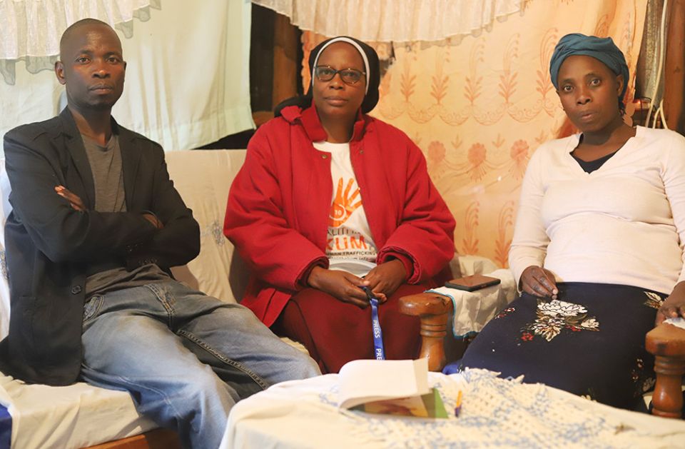 Sr. Mary Magdalene, a member of the Incarnate Word Sisters-Kenya, visits William Monda, 37, and his sister Florence Bosibori in their house in Kibera, the largest slum in Kenya.