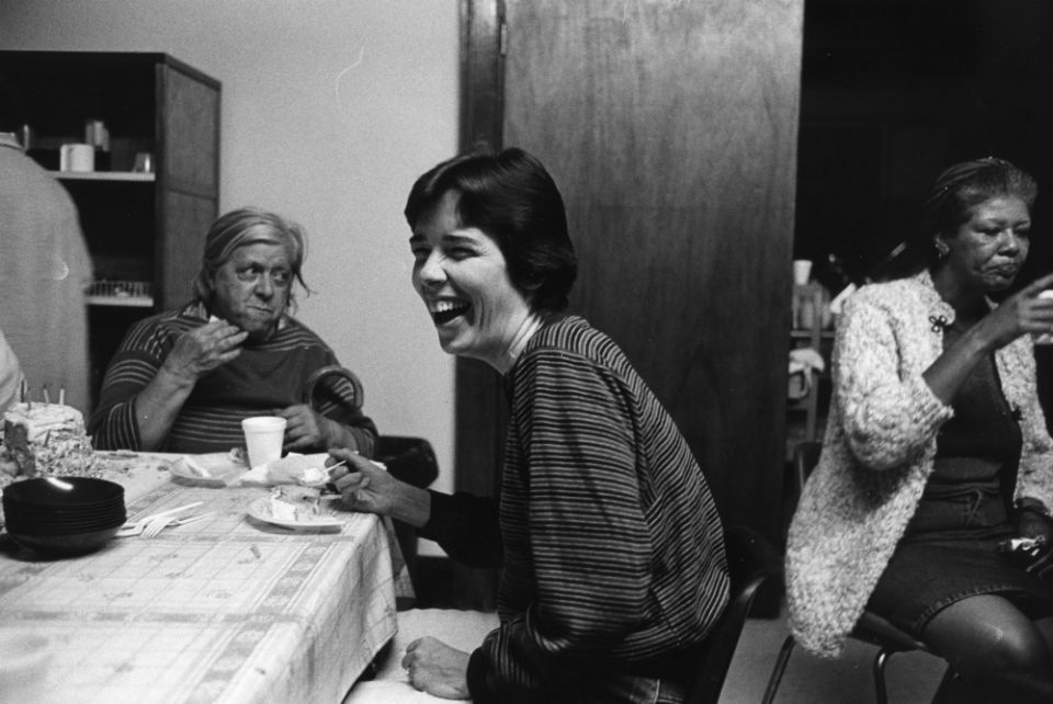 Mercy Sr. Mary Scullion eats cake in the late 1980s with women from Women of Hope, a Philadelphia organization that cares for homeless women with mental illness that Scullion started in 1985 (Courtesy of Project HOME/Harvey Finkle)