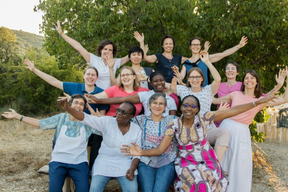 Ten women who have made their first vows pose for a photo with their formators at an August 2019 gathering at the Xavière Sisters' house in La Pourraque, France. (Courtesy of the Xavière Sisters)