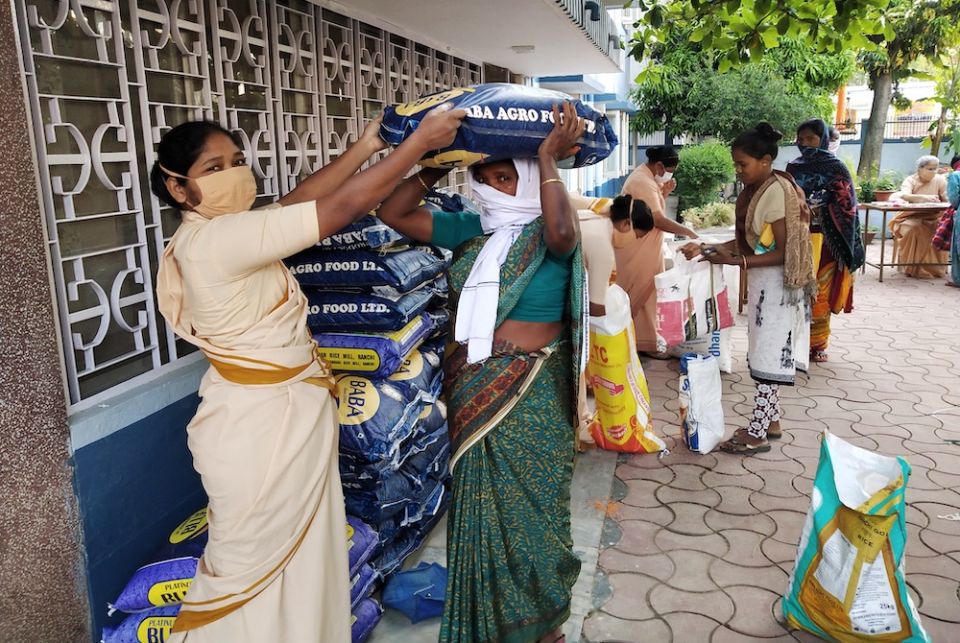 Sisters of the Little Flower of Bethany distribution of provisions in Jharkhand, India, during the coronavirus pandemic. (Courtesy Women's Religious Conference India)