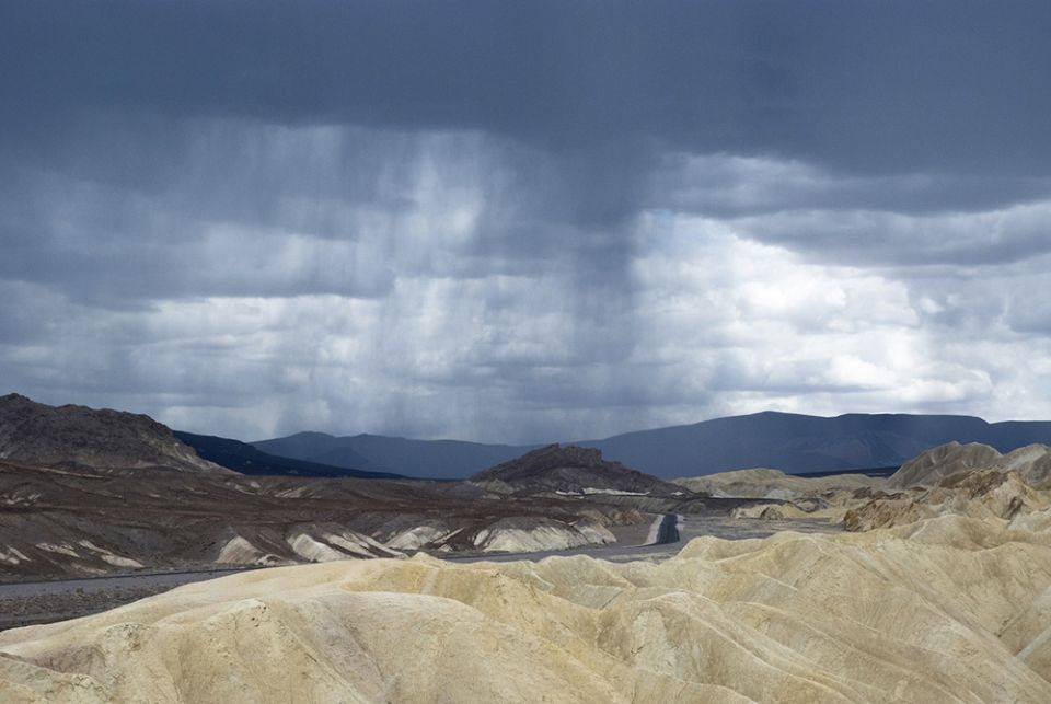 Rain clouds are seen over the landscape in Death Valley National Park, California (Dreamstime/Alexander Reitter)