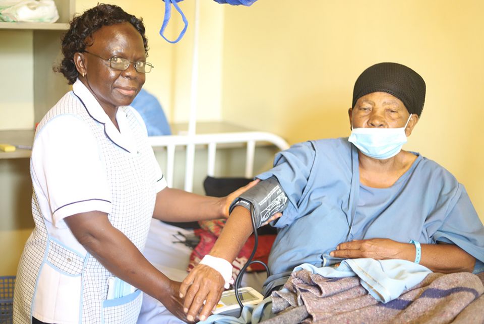A nurse attends to a patient at St. Joseph Hospital June 2 in Gilgil in southwestern Kenya. After losing the first long court battle for the control of the hospitals in September 2017, Dr. William Fryda set up another hospital nearby St. Mary's Mission Ho