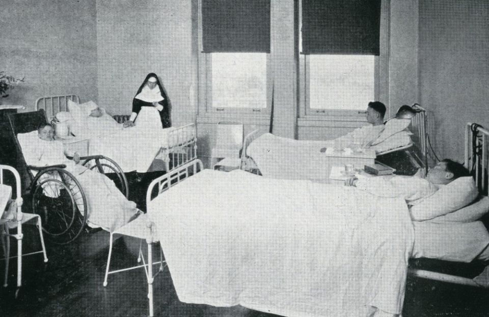 A Sister of Mercy attends patients in a ward at Misericordia Hospital opened in 1918, just before the worst of the flu outbreak. (Catholic Historical Research Center, Archdiocese of Philadelphia)