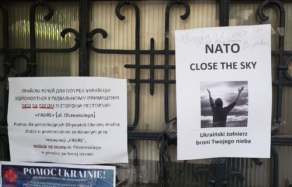 A sign on the doors of the Ukrainian Catholic Church at the center of Krakow, Poland, calls for a NATO-led "No Fly-Zone" over Ukraine. (GSR photo/Chris Herlinger)