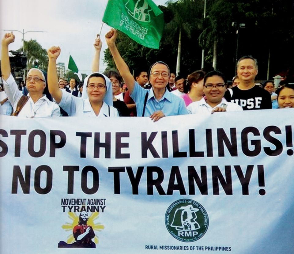 The Rural Missionaries of the Philippines and their allies protest extrajudicial killings at a 2018 rally. (Courtesy of the Rural Missionaries of the Philippines / Malu Maniquis)