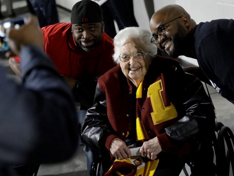 Loyola-Chicago basketball chaplain Sister Jean Dolores Schmidt, poses with fans for a photo before the first half of a regional final NCAA college basketball tournament game on March 24, 2018, in Atlanta. (AP/David Goldman)