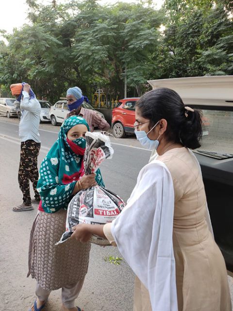 Sr. Rani Punnaserril distributing food packets (Provided photo)