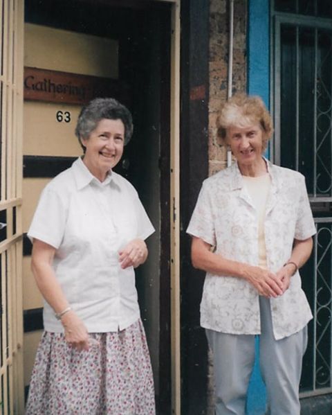 Srs. Esmey Herscovitch (left) and Mary McGowan outside their house in Redfern, Australia, near what has been known as The Block, home to many Indigenous families. (Courtesy of Esmey Herscovitch)