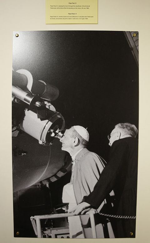 In a photograph on display at the Vatican observatory in Castel Gandolfo, Italy, in 2018, Pope Paul VI views the moon through the Schmidt telescope at the time of the first landing on the moon, July 20, 1969. (CNS/Paul Haring)