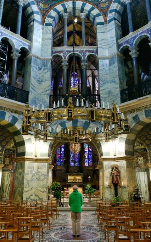 A man prays inside the cathedral in Aachen, Germany, March 25, amid the coronavirus pandemic. (CNS/Reuters/Thilo Schmuelgen) A man prays inside the cathedral in Aachen, Germany, March 25, amid the coronavirus pandemic. (CNS/Reuters/Thilo Schmuelgen)