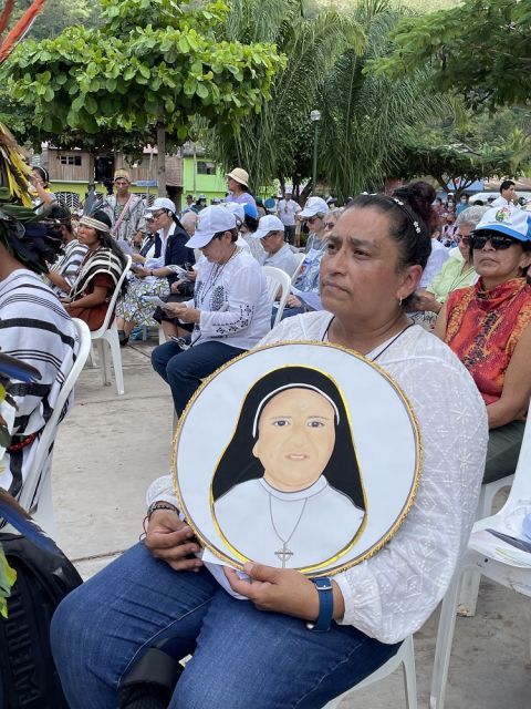 A woman holds an image of of Good Shepherd Sr. Maria Agustina Rivas Lopez during Rivas' beatification Mass on May 7 in La Florida, in Peru's central Amazon region, where she was murdered by terrorists in 1990. (CNS/Peruvian Conference of Bishops/Kurth Men