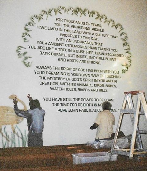 Indigenous men work on the mural in St. Vincent de Paul Church in Redfern, Australia. (Courtesy of Esmey Herscovitch)