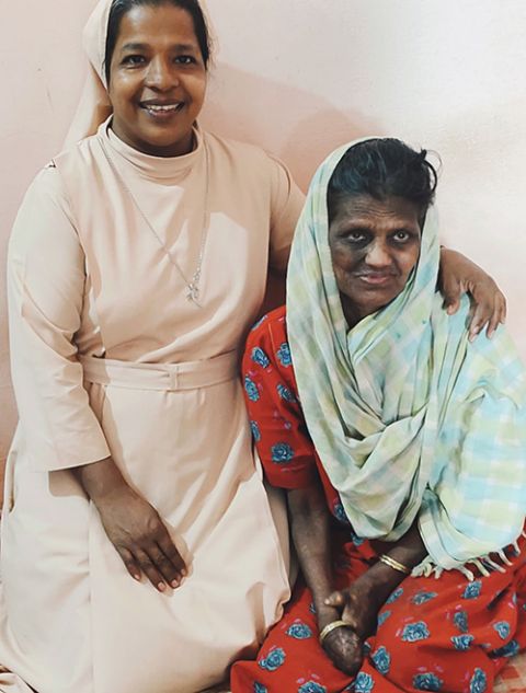 Sr. Christina Fernandes, left, of the Franciscan Sisters of the Immaculate says she draws motivation from the woman at right, who was one of the first patients at Sumanahalli and is like a mother to the sisters. Fernandes has served there for 26 years.
