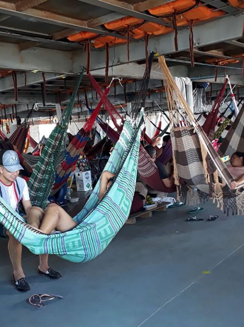 Passengers use hammocks to sleep on the dayslong trip along the Solimões River between Manaus and Tonantins in June 2020. (Courtesy of Sr. Alessandra dos Santos Santana) Passengers use hammocks to sleep on the dayslong trip along the Solimões River between Manaus and Tonantins in June 2020. (Courtesy of Sr. Alessandra dos Santos Santana)