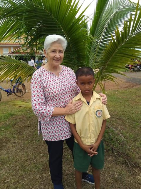 Presentation Sr. Anne Lyons with Rotha, a third-grade student being raised by his grandfather and great-grandmother, on the final day of the school year at Xavier Jesuit School in Phnom Bak, Sisophon, Cambodia, in August 2019 (Courtesy of Anne Lyons)