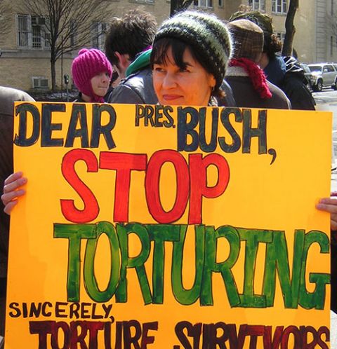 Ursuline Sr. Dianna Ortiz holds a sign for then-president George W. Bush during a 2007 anti-torture vigil by Torture Abolition and Survivors Support Coalition members in Washington, D.C. (Courtesy of the Ursuline Sisters of Mount St. Joseph) Ursuline Sr. Dianna Ortiz holds a sign for then-president George W. Bush during a 2007 anti-torture vigil by Torture Abolition and Survivors Support Coalition members in Washington, D.C. (Courtesy of the Ursuline Sisters of Mount St. Joseph)