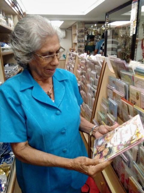 A woman who frequents the Pauline Books and Media Center in Goa, India, peruses books. (Lissy Maruthanakuzhy)
