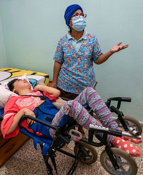 Sr. Sandra Hernández with Nichole, a 17-year-old resident of Casa Corazón de la Misericordia. Nichole lives with cerebral palsy. (Gregg Brekke)
