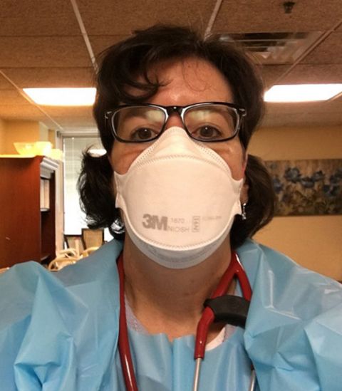 Mercy Sr. Karen Scheer, a physician in Philadelphia, prepares for house calls in her personal protective equipment. (Courtesy of the Sisters of Mercy)