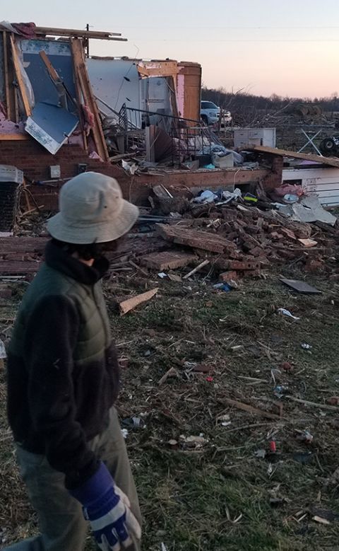 Julia Gerwe surveys damage caused by the Dec. 10, 2021, tornadoes in western Kentucky. (Courtesy of Erica Watts)