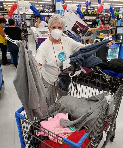 St. Joseph Sr. Sharon White shops for clothing and supplies for migrants staying at the Humanitarian Respite Center in McAllen, Texas. (Courtesy of the Sisters of St. Joseph)