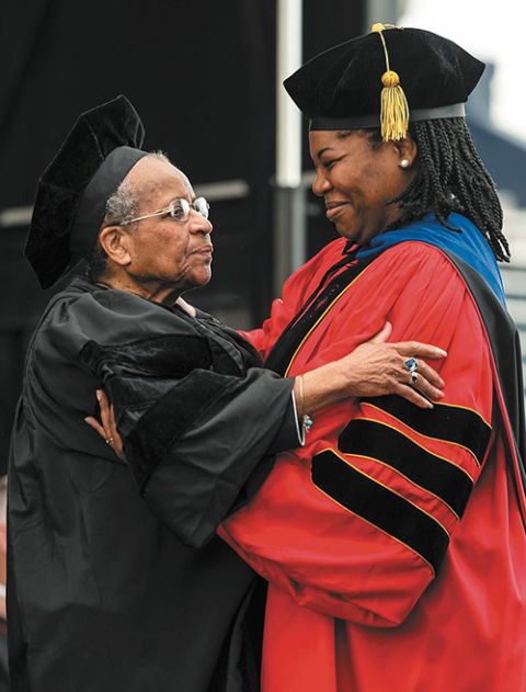 Shannen Dee Williams, right, presents Mercy Sr. Cora Marie Billings with an honorary doctoral degree at Villanova University's commencement ceremony in May 2019. (Courtesy of Sisters of Mercy)