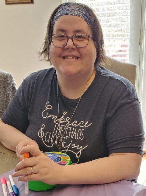 Susan Rose Francois in her "Embrace the Chaos and Choose Joy" T-shirt while decorating Easter eggs with her nephew earlier this year (Courtesy of Susan Rose Francois)