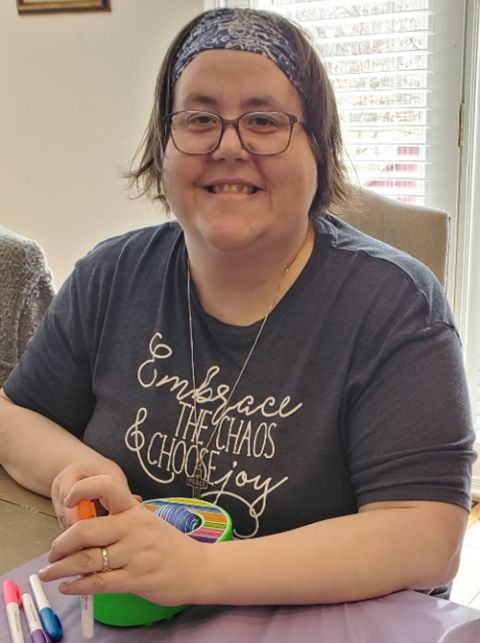 Susan Rose Francois in her "Embrace the Chaos and Choose Joy" T-shirt Susan Rose Francois in her "Embrace the Chaos and Choose Joy" T-shirt while decorating Easter eggs with her nephew earlier this year (Courtesy of Susan Rose Francois)