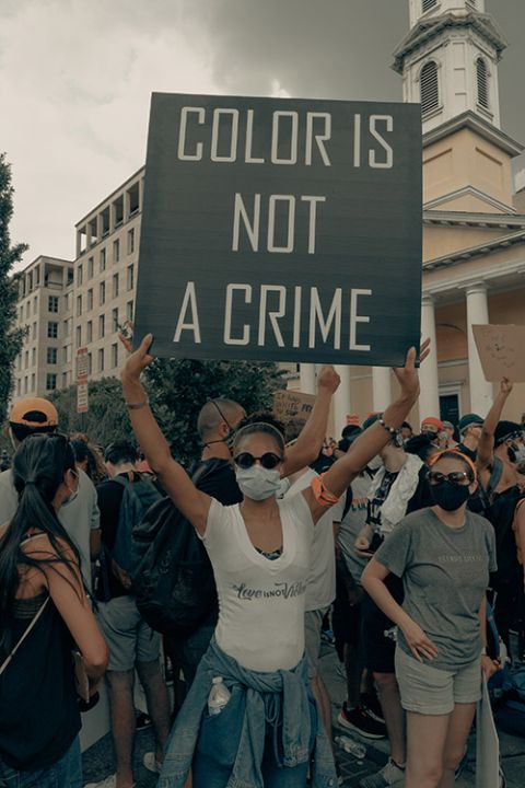 Woman holds up sign at a Black Lives Matter protest in Washington, D.C., June 6, 2020. (Unsplash/Clay Banks)