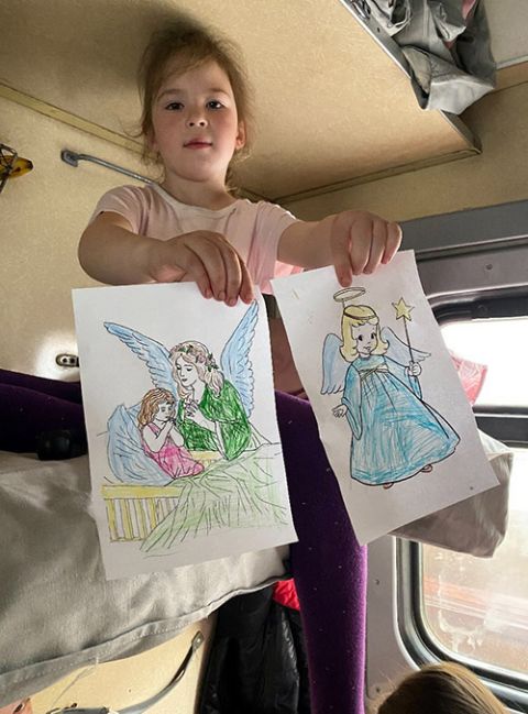 One of the many children fleeing from eastern Ukraine. Basilian Sr. Teodora Kopyn had given them colored pencils and pictures she had printed. She convinced this little girl to color angels instead of the devil she had first drawn to represent the war.