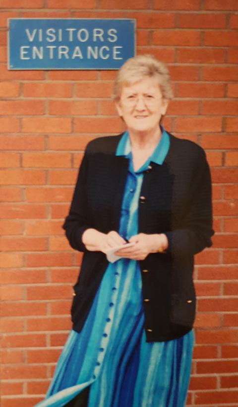 Sister Imelda stands outside a prison in Ireland in 2005, waiting to meet some of the families of those in prison. (Courtesy of Sr. Imelda Wickham) 