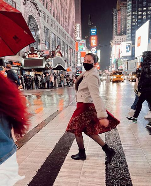 My roommate, Maria Jose Miranda, runs across the street in Times Square after we visited a few Christmas markets and took in the Rockefeller Center tree. (Courtesy of Caileigh Pattisall)