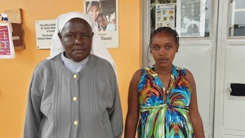 Sr. Mary Lunyolo, a member of Sisters of Mary of Kakamega, poses for a photo with Rachael Weginga, a social worker at St. Kizito Baby's Home in eastern Uganda. (Gerald Matembu) 